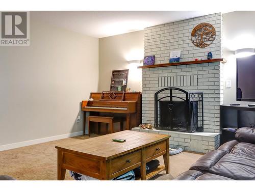 3035 Pleasant Valley Road, Armstrong, BC - Indoor Photo Showing Living Room With Fireplace