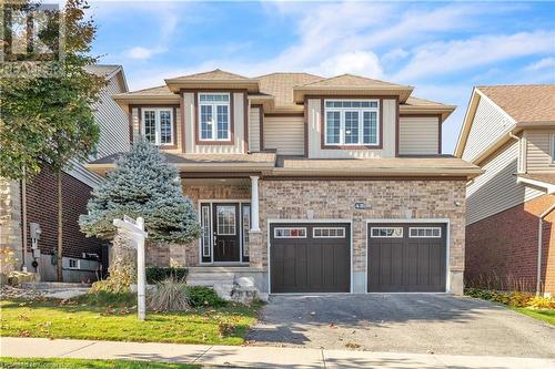 View of front facade with a garage - 48 Isaiah Drive, Kitchener, ON 