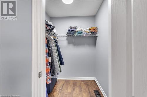 Walk in closet featuring wood-type flooring - 48 Isaiah Drive, Kitchener, ON 