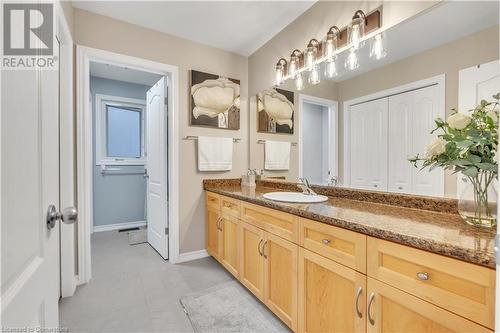 Bathroom featuring tile patterned floors and vanity - 48 Isaiah Drive, Kitchener, ON 