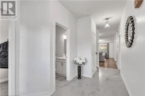 Hall featuring a textured ceiling - 48 Isaiah Drive, Kitchener, ON 