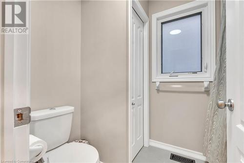 Bathroom with tile patterned floors and toilet - 48 Isaiah Drive, Kitchener, ON 