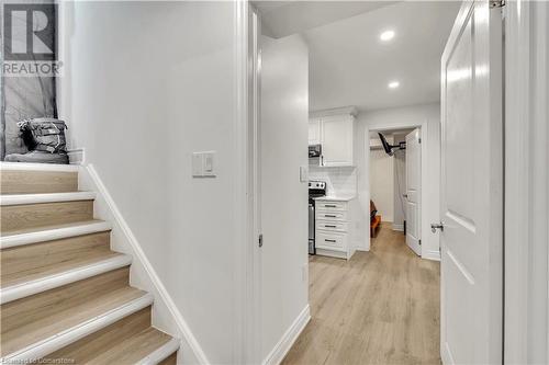 Stairs with hardwood / wood-style flooring - 48 Isaiah Drive, Kitchener, ON 