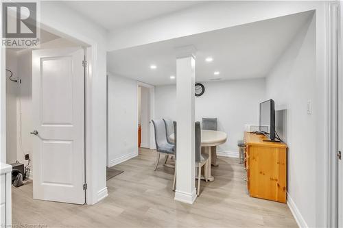 Dining area with light hardwood / wood-style floors - 48 Isaiah Drive, Kitchener, ON 