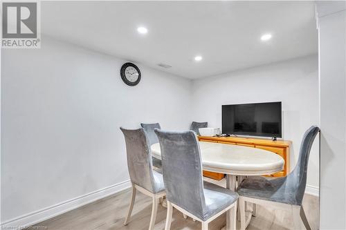 Dining room featuring light wood-type flooring - 48 Isaiah Drive, Kitchener, ON 