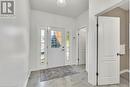 Foyer entrance featuring a textured ceiling - 48 Isaiah Drive, Kitchener, ON 