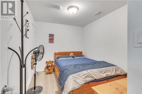 Bedroom with hardwood / wood-style floors - 48 Isaiah Drive, Kitchener, ON 