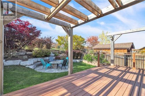 Wooden deck with a yard, a pergola, an outdoor fire pit, and a patio area - 48 Isaiah Drive, Kitchener, ON 