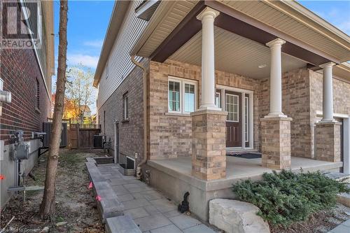 Doorway to property with covered porch - 48 Isaiah Drive, Kitchener, ON 