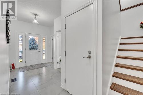 Entrance foyer featuring a textured ceiling - 48 Isaiah Drive, Kitchener, ON 