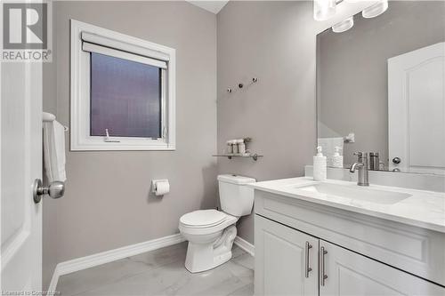 Bathroom featuring vanity and toilet - 48 Isaiah Drive, Kitchener, ON 