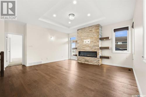 4134 Green Olive Way E, Regina, SK - Indoor Photo Showing Living Room With Fireplace