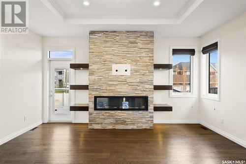 4134 Green Olive Way E, Regina, SK - Indoor Photo Showing Living Room With Fireplace