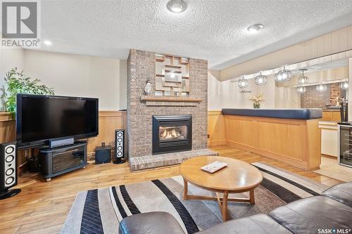 26 Kindrachuk Crescent, Saskatoon, SK - Indoor Photo Showing Living Room With Fireplace