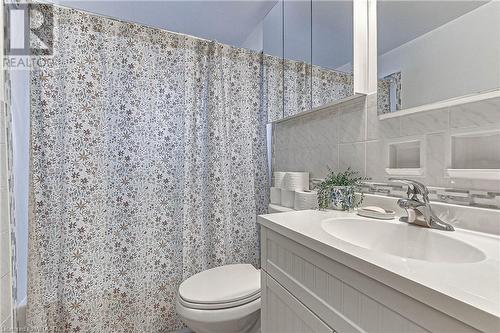 Bathroom with vanity, toilet, tile walls, and walk in shower - 476 Prospect Street, Kitchener, ON 