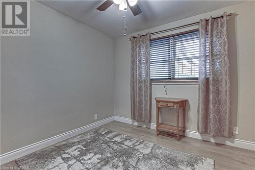 Empty room featuring wood-type flooring and ceiling fan - 476 Prospect Street, Kitchener, ON 