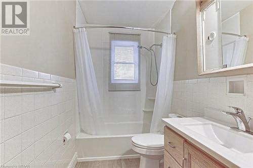 Full bathroom featuring shower / tub combo, vanity, toilet, and tile walls - 476 Prospect Street, Kitchener, ON 