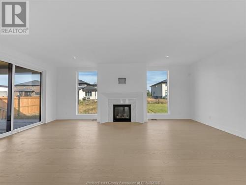 4557 Valerio Crescent, Lasalle, ON - Indoor Photo Showing Living Room With Fireplace