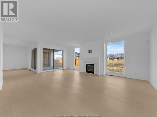 4557 Valerio Crescent, Lasalle, ON - Indoor Photo Showing Living Room With Fireplace