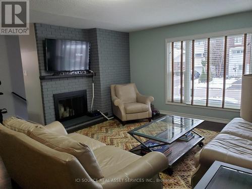 Main Fl - 32 Harnworth Drive, Toronto, ON - Indoor Photo Showing Living Room With Fireplace