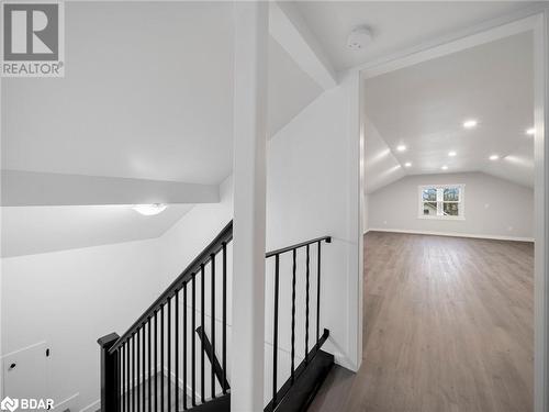 Additional living space featuring wood-type flooring and vaulted ceiling - 206 Mary Street, Orillia, ON 