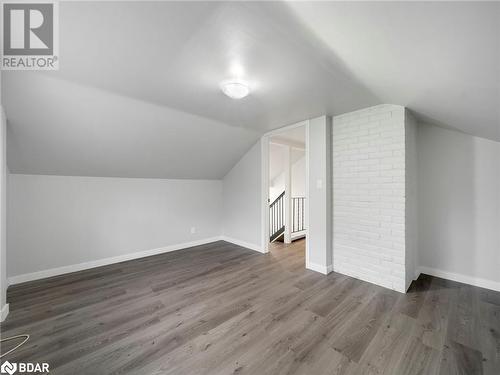 Bonus room featuring dark hardwood / wood-style floors and lofted ceiling - 206 Mary Street, Orillia, ON 