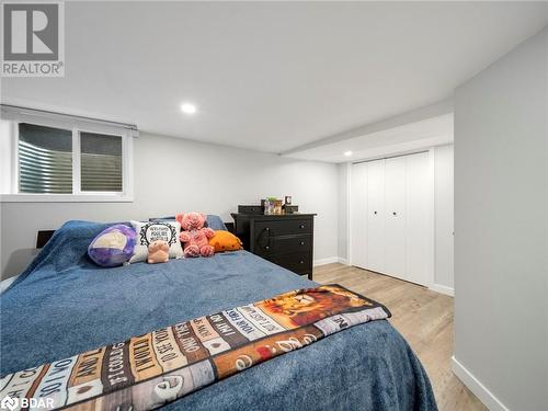 Bedroom with light hardwood / wood-style floors and a closet - 206 Mary Street, Orillia, ON 