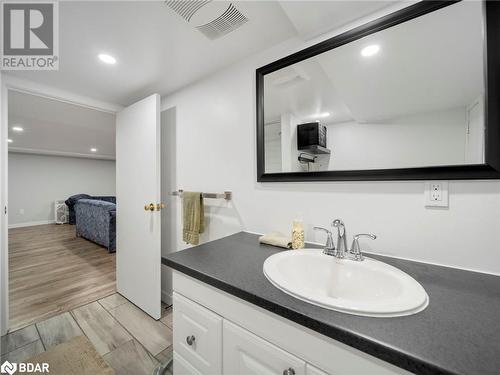 Bathroom with hardwood / wood-style floors and vanity - 206 Mary Street, Orillia, ON 