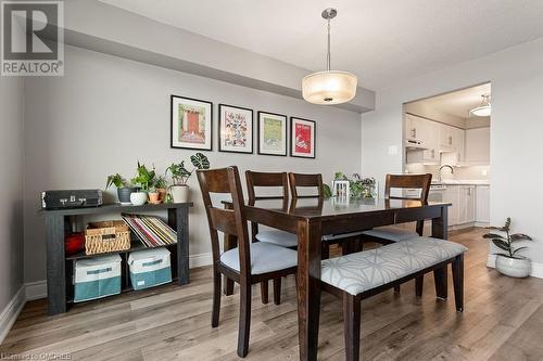 Dining area featuring light hardwood / wood-style flooring and sink - 9 Bonheur Court Unit# 802, Brantford, ON 