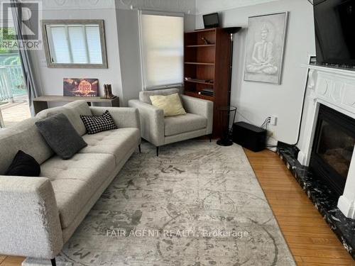 16 Woodward Avenue, London, ON - Indoor Photo Showing Living Room With Fireplace