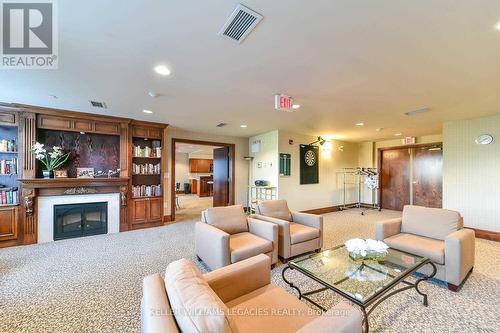 102 - 55 Via Rosedale Way, Brampton, ON - Indoor Photo Showing Living Room With Fireplace