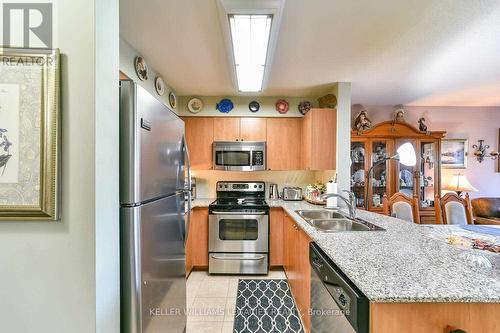 102 - 55 Via Rosedale Way, Brampton, ON - Indoor Photo Showing Kitchen With Double Sink