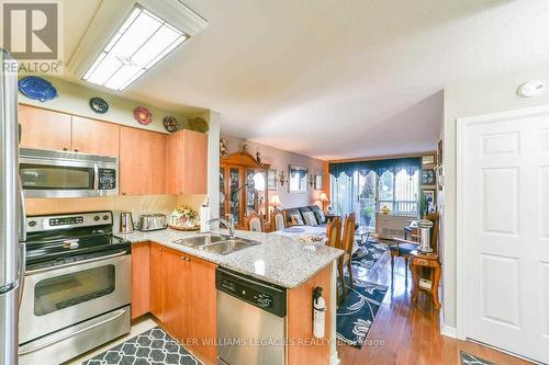 102 - 55 Via Rosedale Way, Brampton, ON - Indoor Photo Showing Kitchen With Double Sink