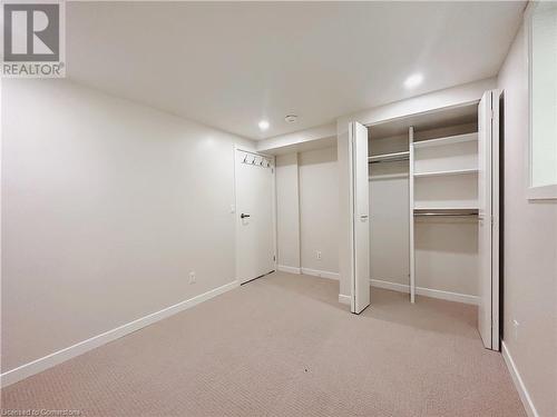 Unfurnished bedroom with light colored carpet and a closet - 20 Pintail Place, Cambridge, ON 