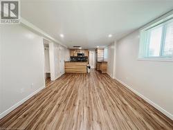 Unfurnished living room featuring light wood-type flooring - 