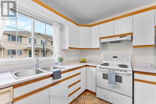 27 - 7470 Monastery Drive, Niagara Falls (208 - Mt. Carmel), ON - Indoor Photo Showing Kitchen With Double Sink