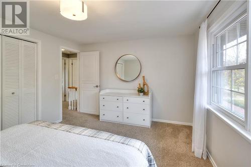 Bedroom featuring light colored carpet and a closet - 147 Dalewood Drive, Kitchener, ON 