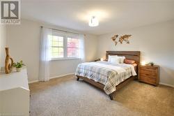 Bedroom with light carpet - 