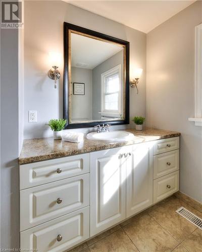 Bathroom featuring tile patterned flooring and vanity - 147 Dalewood Drive, Kitchener, ON 