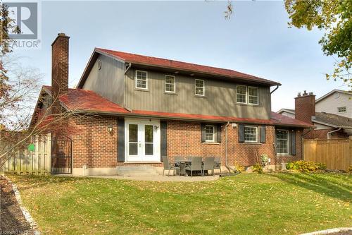 Rear view of property featuring a patio area and a yard - 147 Dalewood Drive, Kitchener, ON 