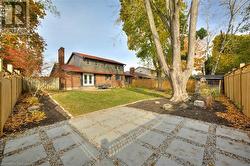 Back of house featuring a patio and a lawn - 