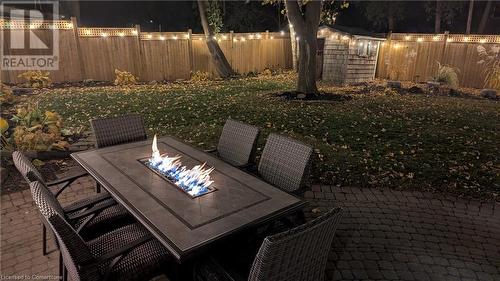 Patio at twilight featuring a lawn - 147 Dalewood Drive, Kitchener, ON 