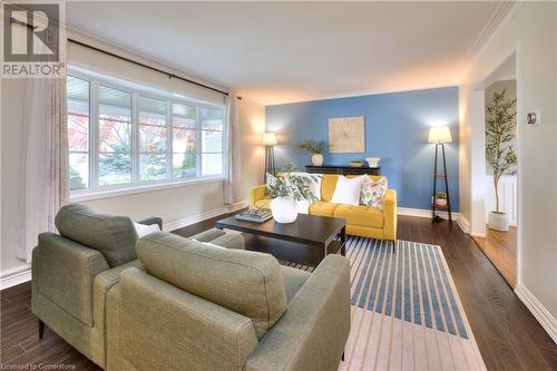 Living room featuring dark hardwood / wood-style flooring and ornamental molding - 147 Dalewood Drive, Kitchener, ON 