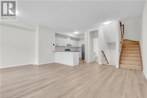 Unfurnished living room featuring light hardwood / wood-style flooring - 677 Park Road N Unit# 147, Brantford, ON 