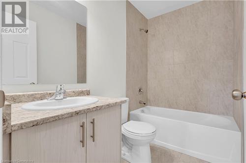 Full bathroom featuring tile patterned floors, vanity, toilet, and tiled shower / bath - 677 Park Road N Unit# 147, Brantford, ON 