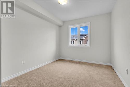 View of carpeted spare room - 677 Park Road N Unit# 147, Brantford, ON 