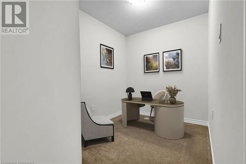 Office space with carpet and a textured ceiling - 677 Park Road N Unit# 147, Brantford, ON 