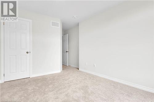 Unfurnished bedroom with light colored carpet - 677 Park Road N Unit# 147, Brantford, ON 