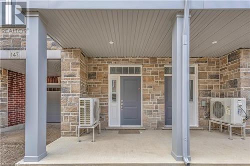 Doorway to property featuring ac unit - 677 Park Road N Unit# 147, Brantford, ON 