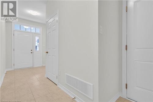 Entrance foyer featuring light tile patterned floors - 677 Park Road N Unit# 147, Brantford, ON 